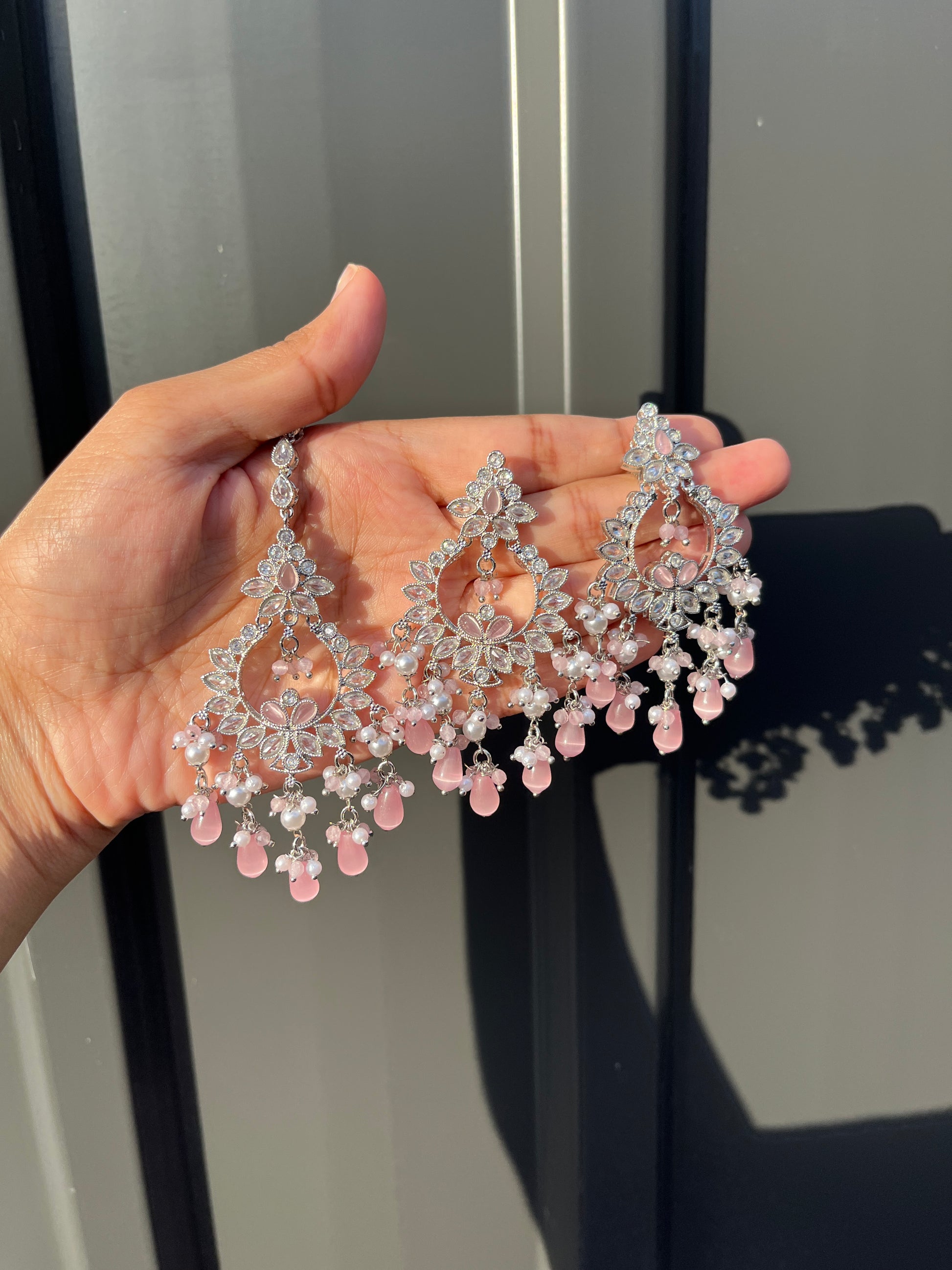 Earring and Tikka - Silver Choker, Earring and Tikka set with White and Pink Coloured Stones. High-quality and perfect for indian weddings, bridal showers, functions, events, festivals and to give as gifts.