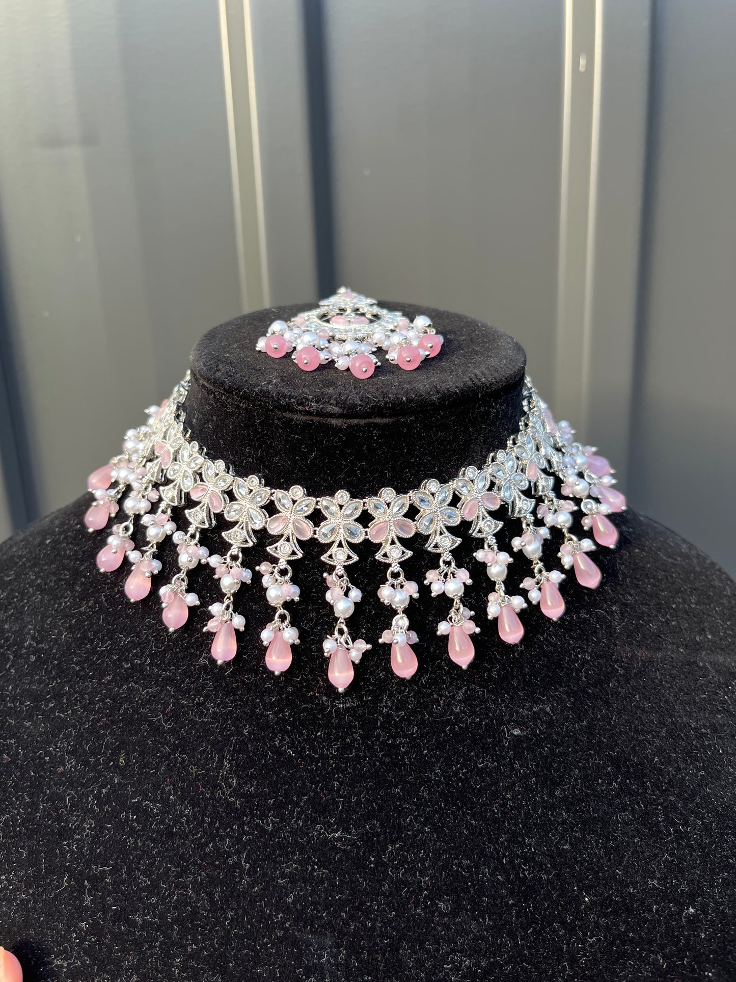 Necklace and Tikka - Silver Choker, Earring and Tikka set with White and Pink Coloured Stones. High-quality and perfect for indian weddings, bridal showers, functions, events, festivals and to give as gifts.