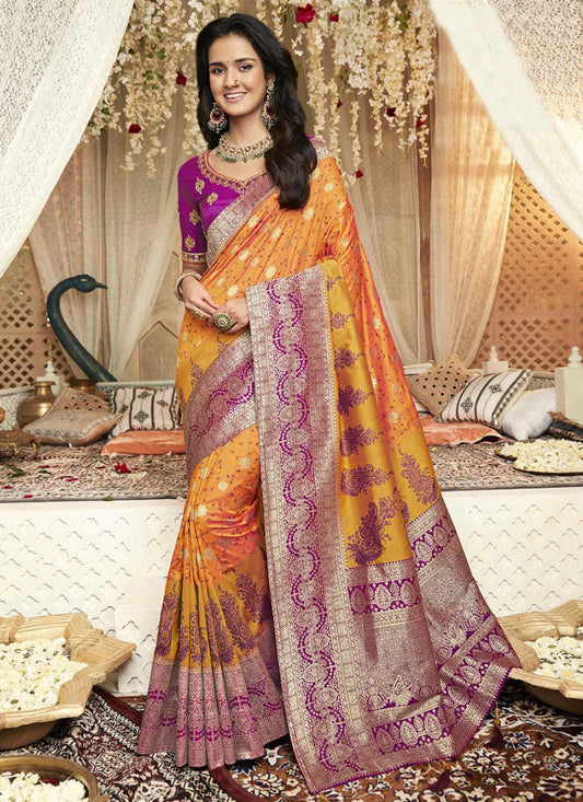 Fancy Silk Saree with a Rich Purple Blouse material and a Marigold Double Shaded pallu/saree.